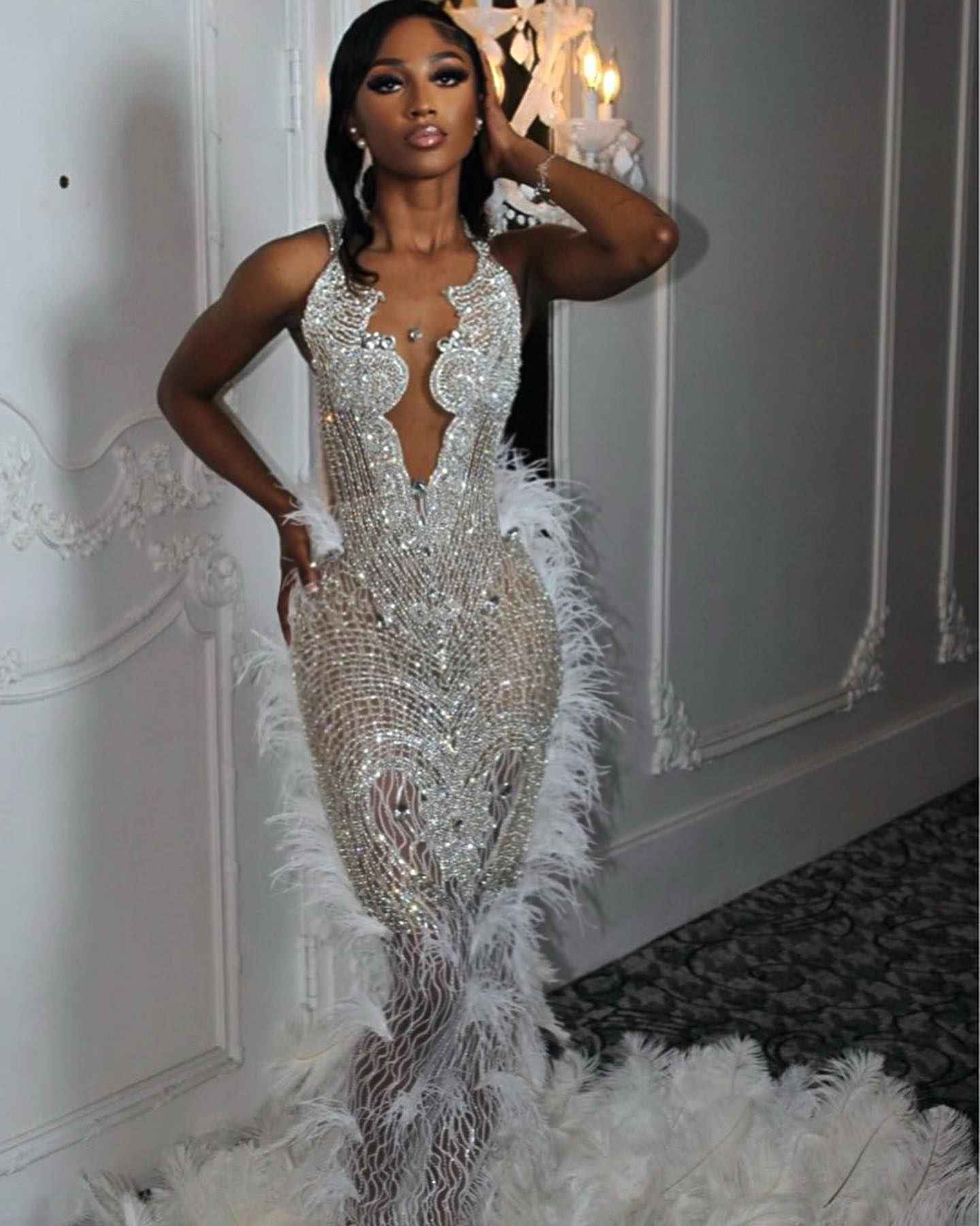 The White Angel - 2026 White Silver Crystal Feather Mermaid Gown: Plunging V-Neckline with Crystal Straps, Open Back & Feather Cathedral Train