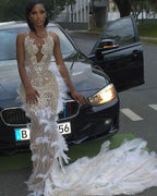 The White Angel - 2026 White Silver Crystal Feather Mermaid Gown: Plunging V-Neckline with Crystal Straps, Open Back & Feather Cathedral Train
