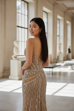 Customer wearing champagne gold art deco beaded evening gown - back