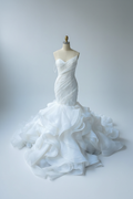 One-shoulder mermaid wedding dress with dramatic ruffled petals - front view