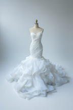One-shoulder mermaid wedding dress with dramatic ruffled petals - front view