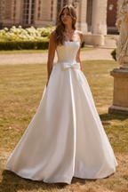 Bride wearing white pearl beaded corset A-line ball gown